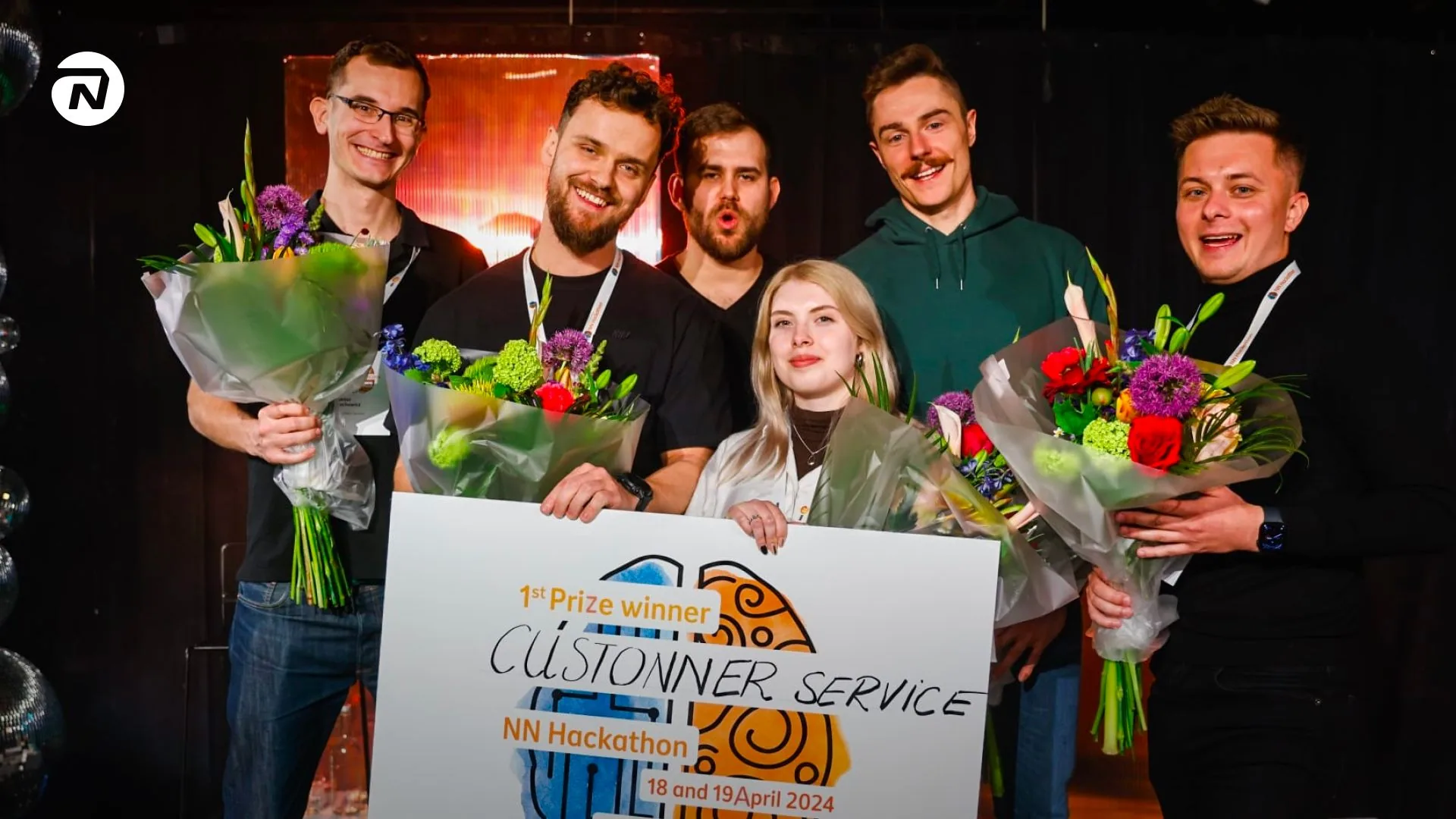 Winning team holding the first-prize board at the Nationale-Nederlanden International Hackathon, 2024
